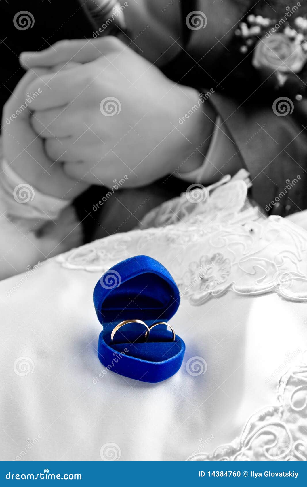 Interlocked Wedding Rings On A Cushion Stock Photo