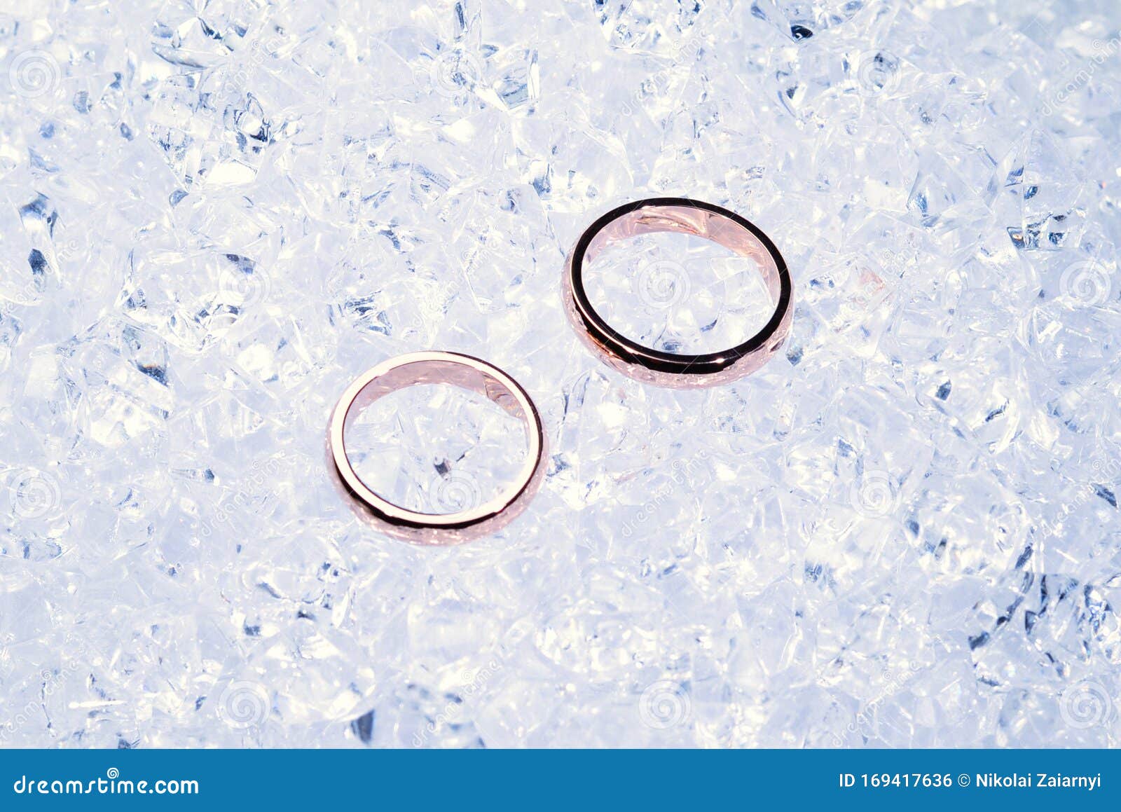 Two Golden Wedding Rings on Ice Stock Photo Image of background