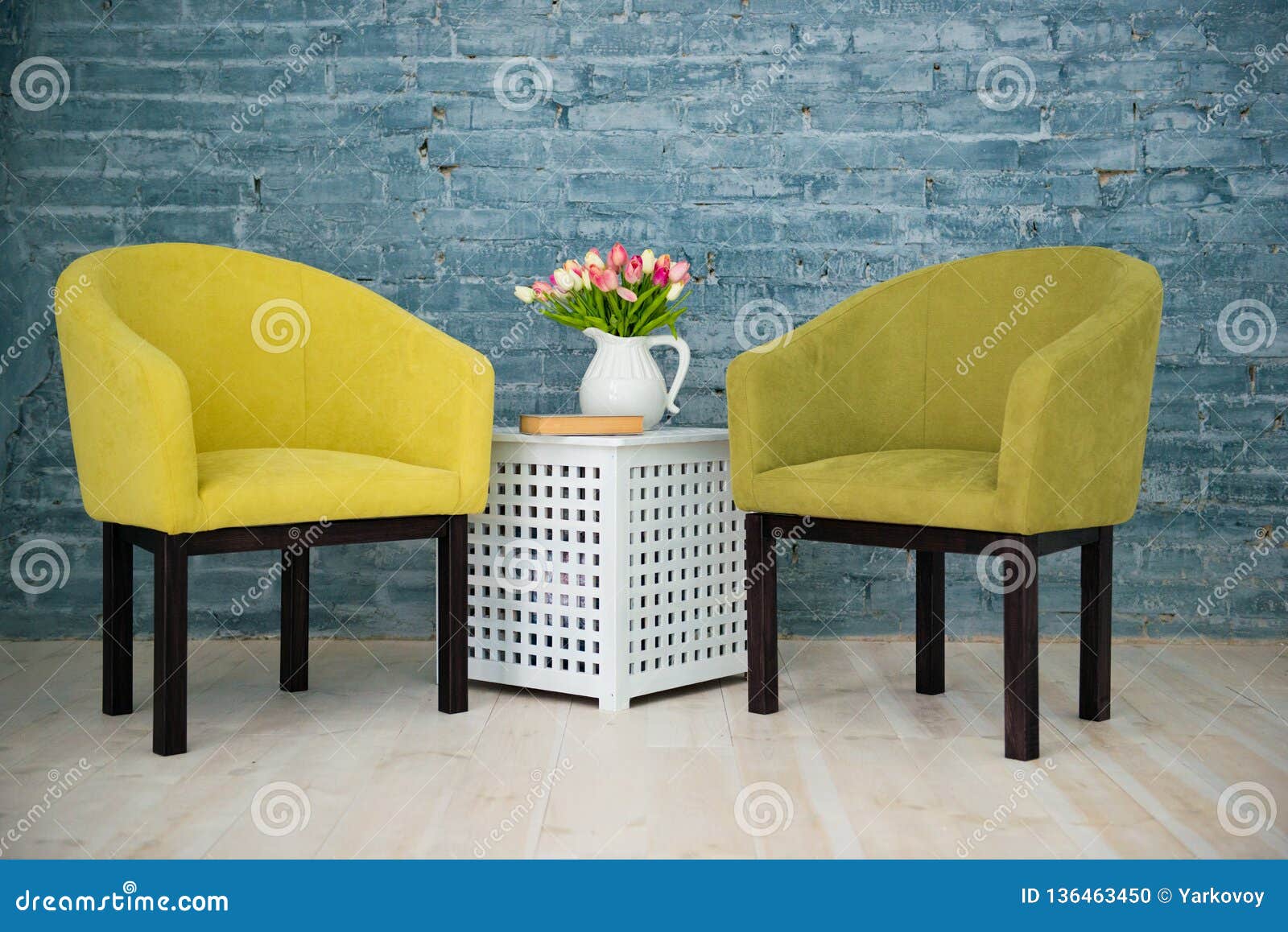 Two Green Chairs on the Background of a Gray Brick Wall. Interior Stock