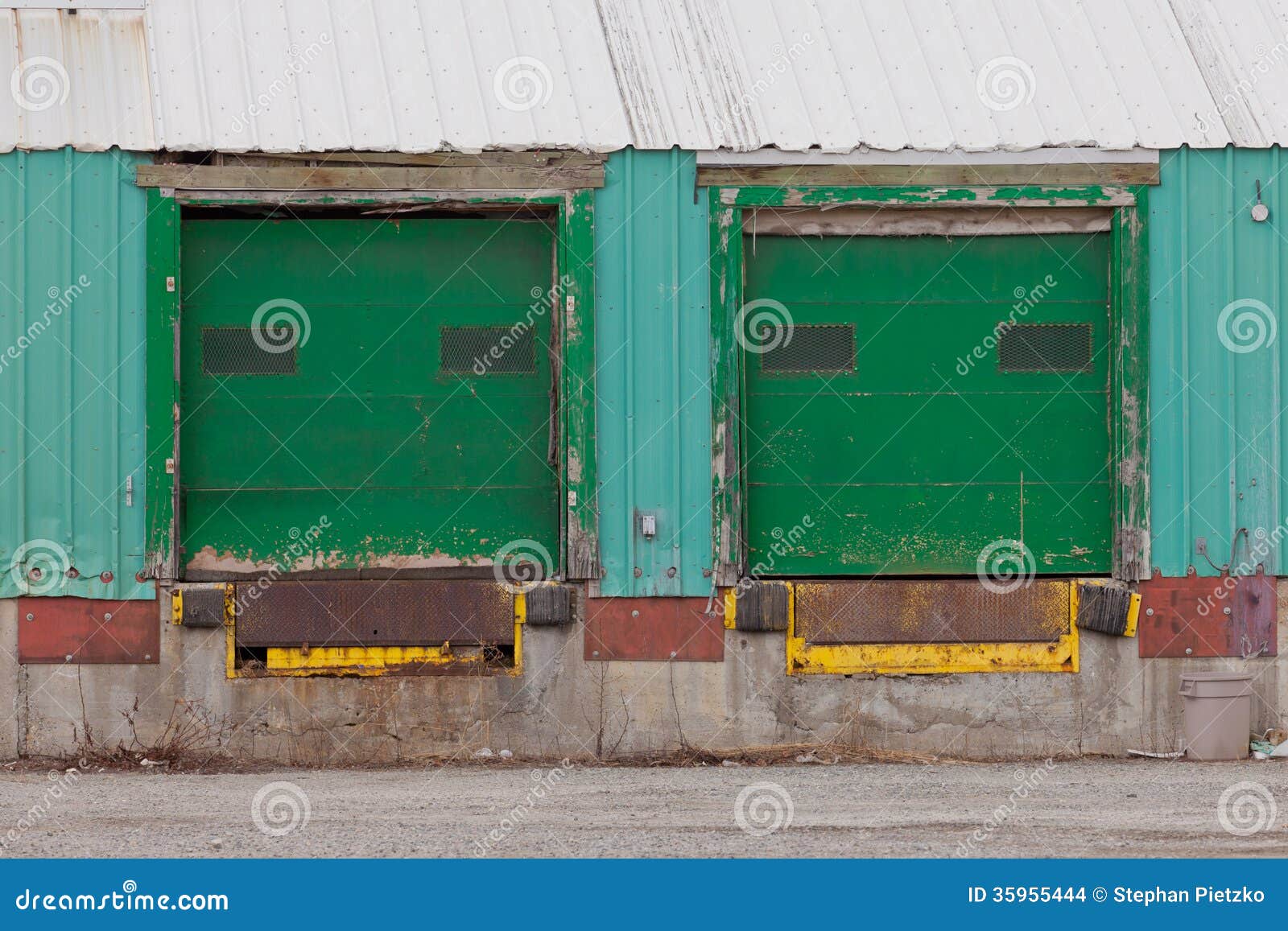 two green shuttered outside loading gate ramps