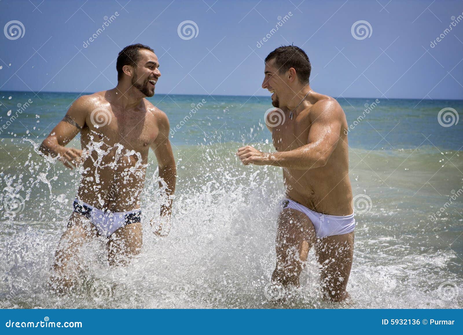 girl and two guys at the beach