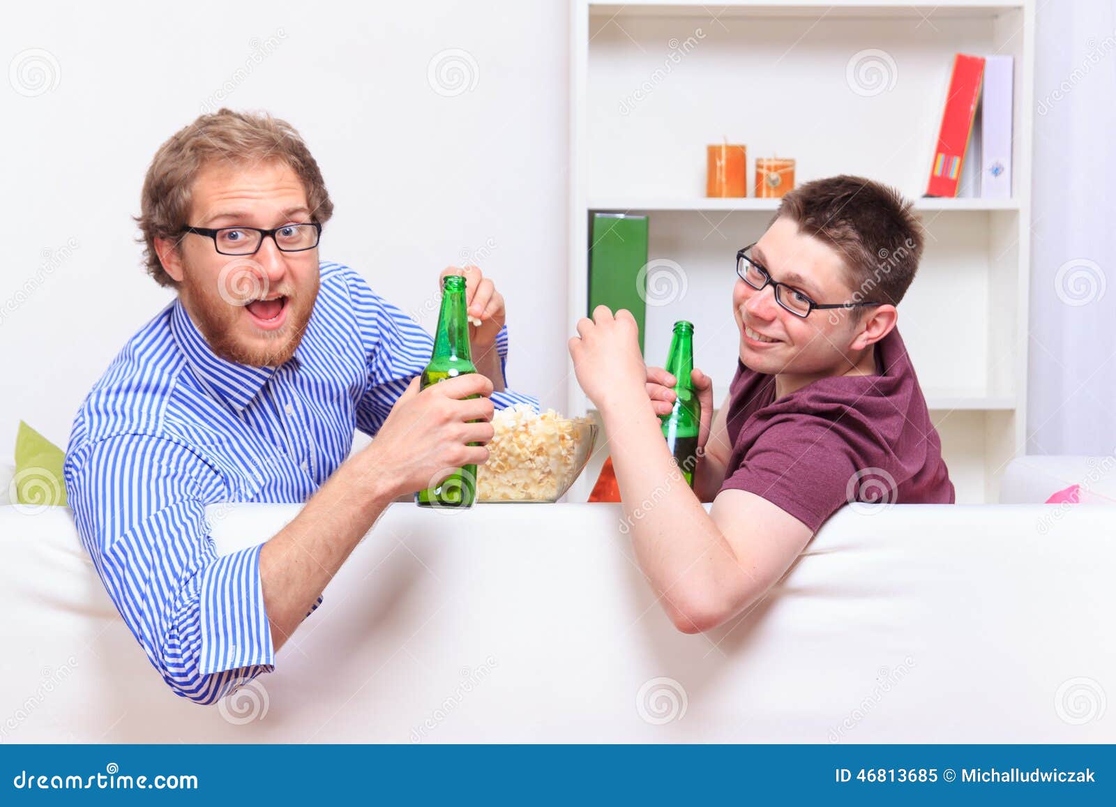 Two Guys with Beer and Popcorn on the Sofa Stock Image Image of