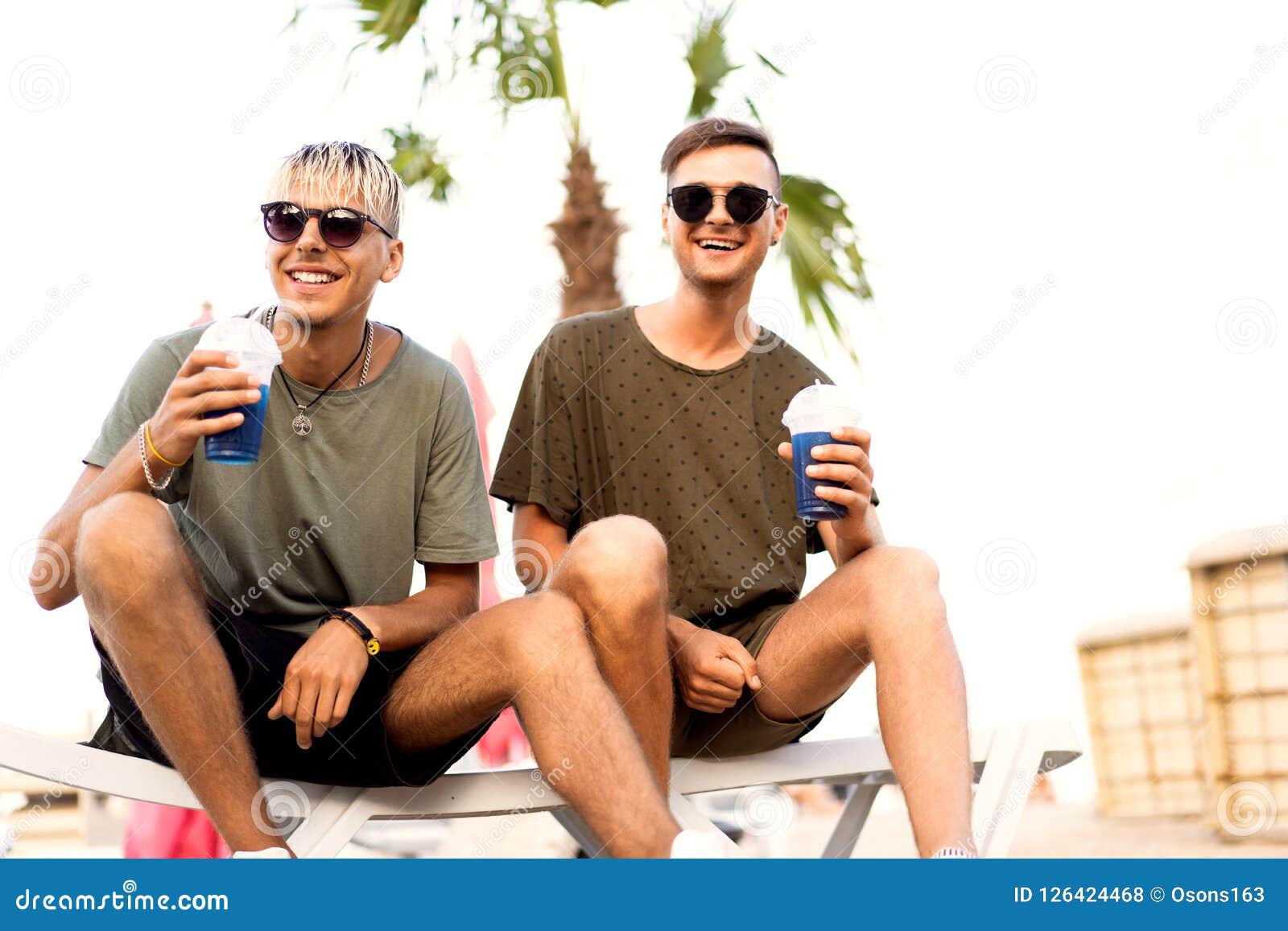 Two Guys Drink Cocktails on a Tropical Beach Stock Photo Image of