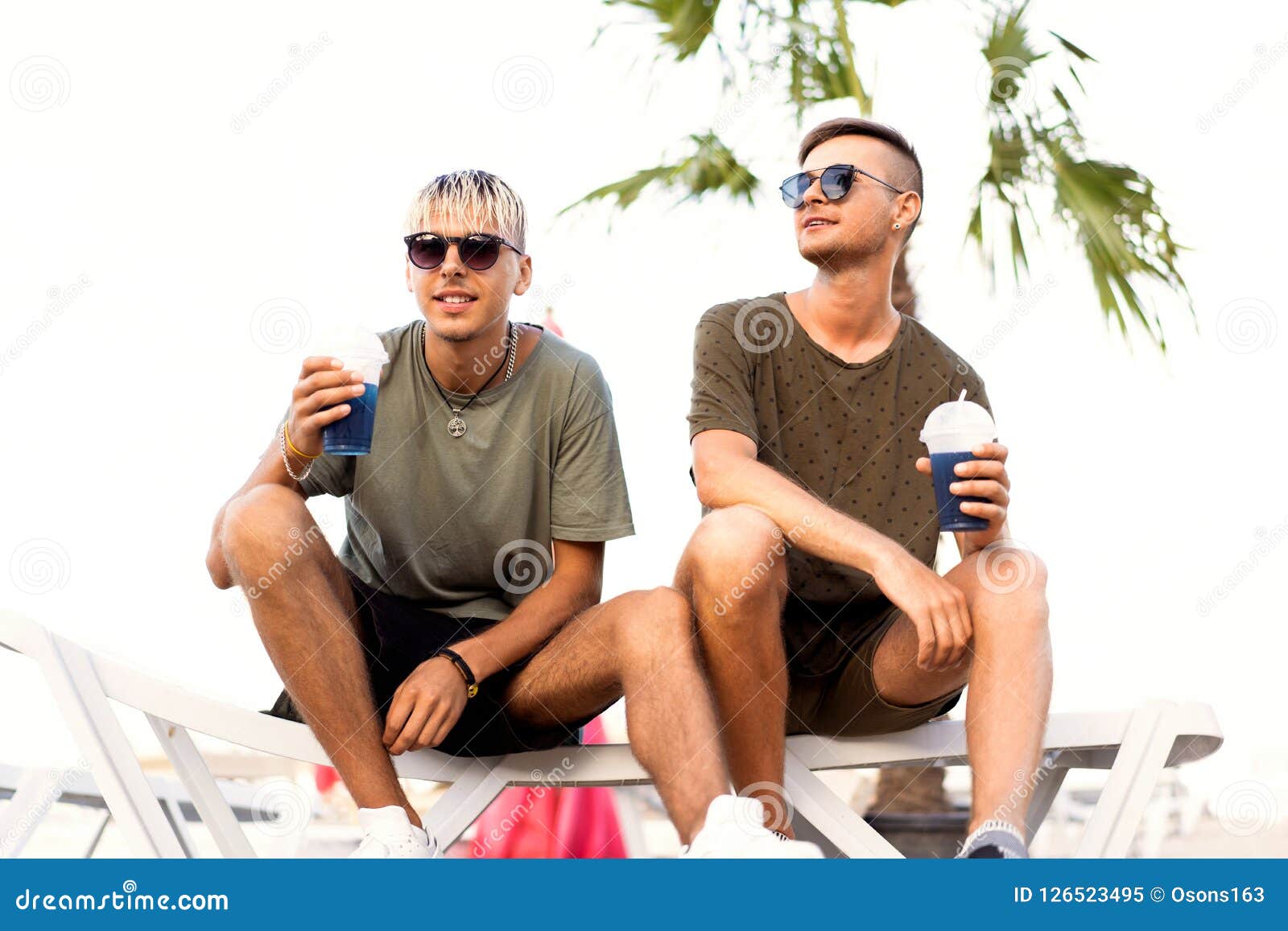 Two Guys Drink Cocktails on a Tropical Beach Stock Image Image of