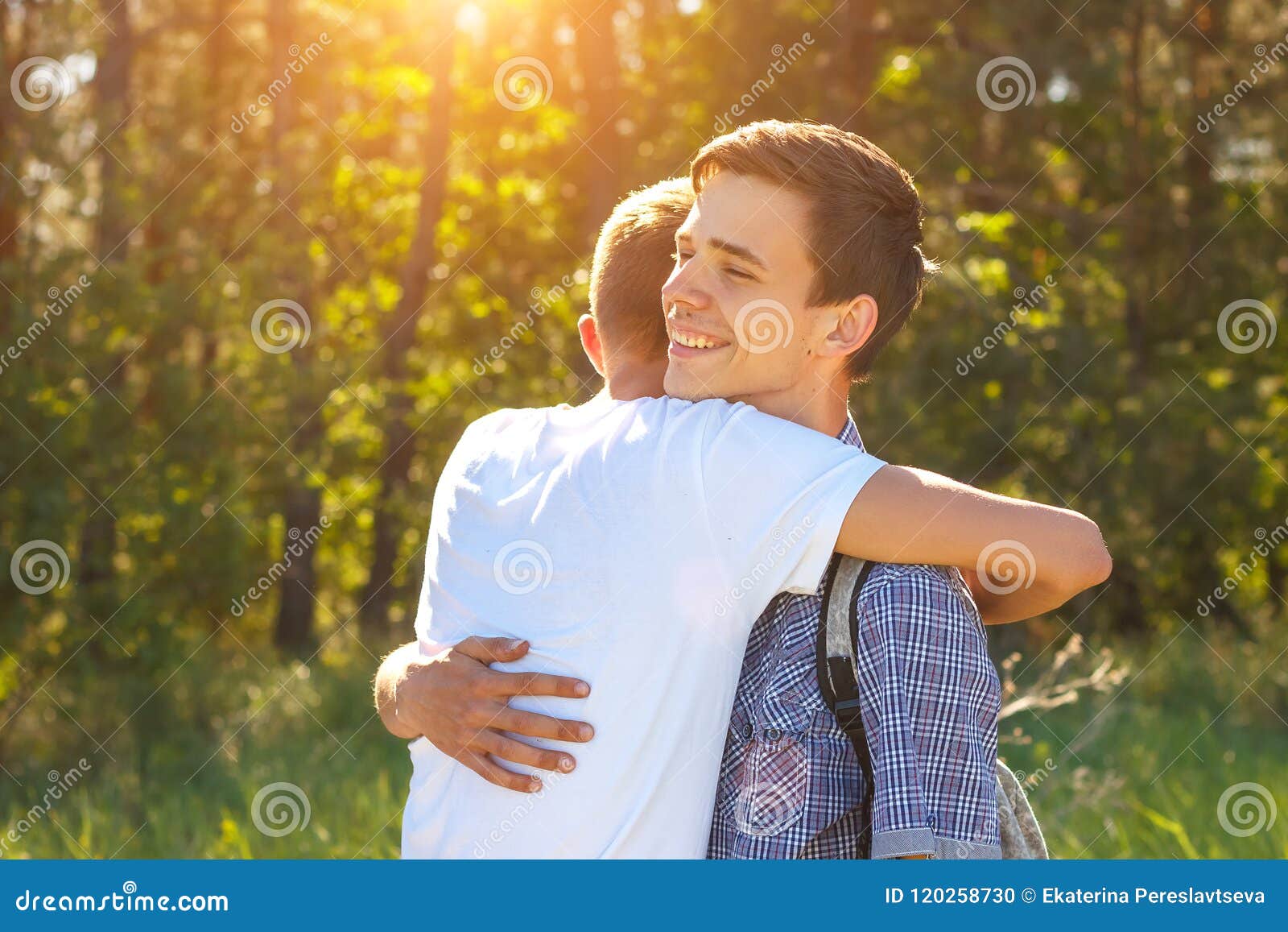 Two Guys Friends Hugging When Meeting The Concept Of Happiness Stock
