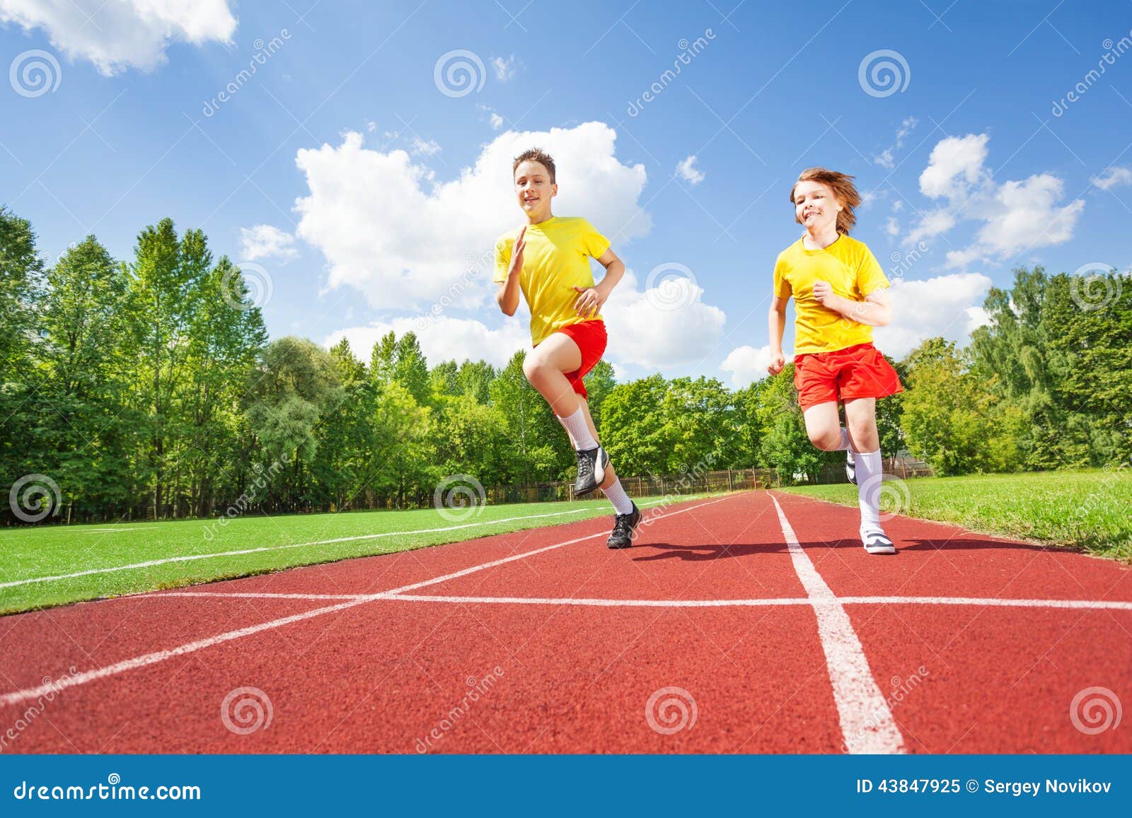 two guys running together in competition