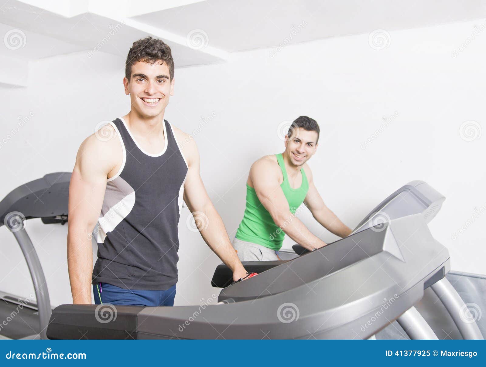 Two guys on treadmill stock image. Image of spanish, male 41377925