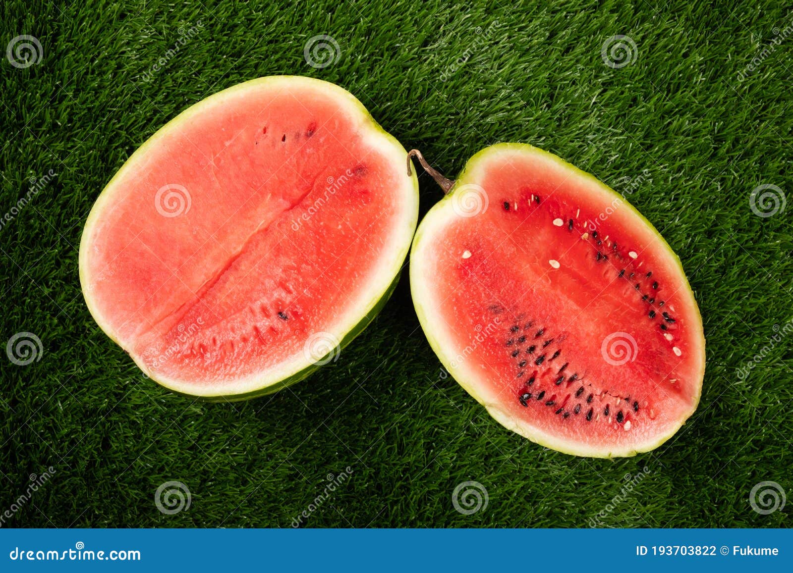 Two Half Red Watermelon on Green Grass, Summer Fruitn Stock Photo