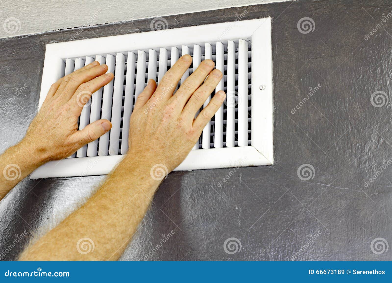 two hands in front of an air vent