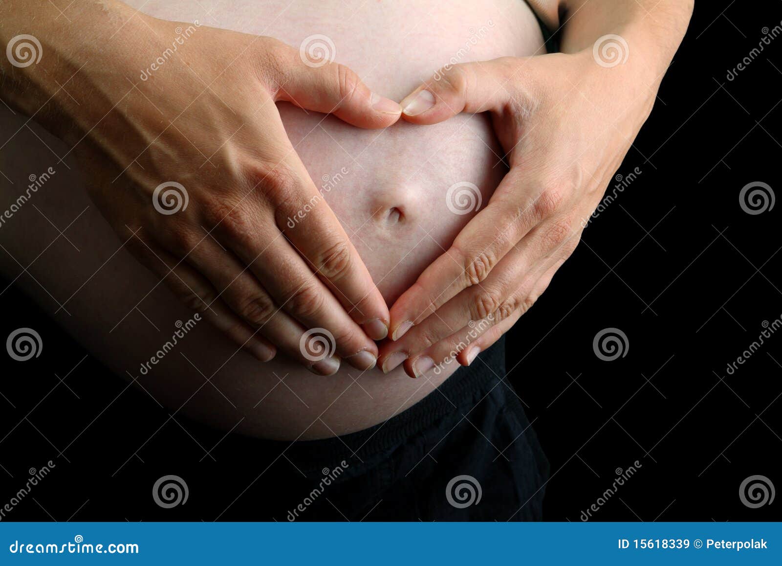 Two Hands Make a Heart on Pregnant Belly on Black Stock Image Image