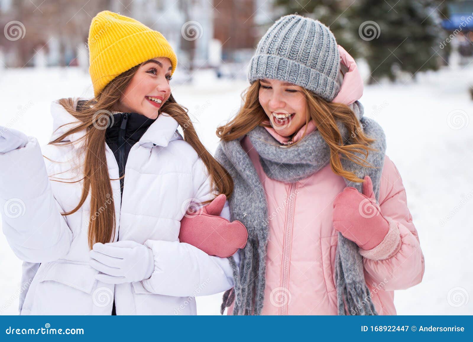 Two Happy Beautiful Girlfriends Walk in the Winter in a City Park Stock ...