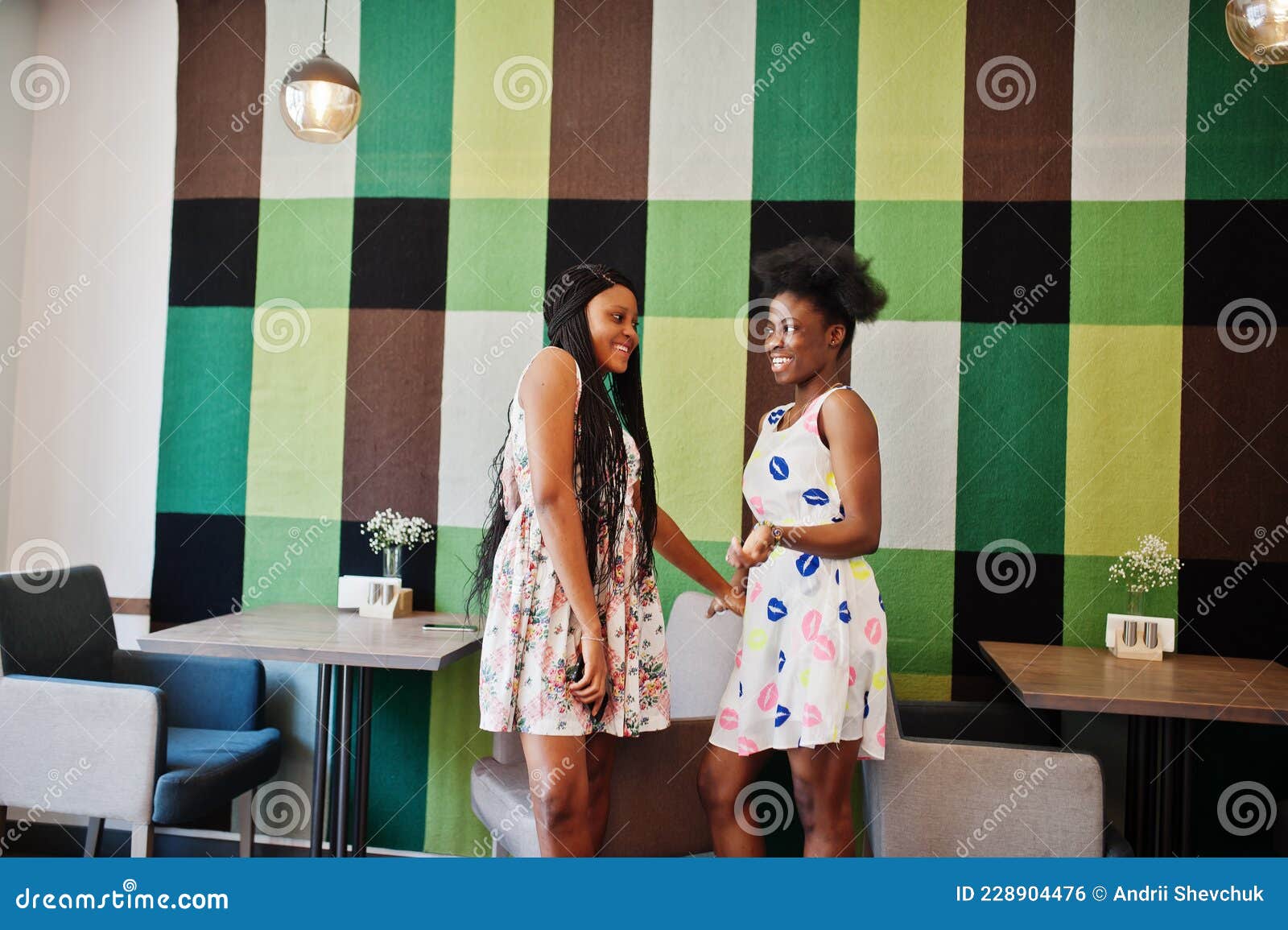 Two Black African Girlfriends at Summer Dresses Posed at Caf