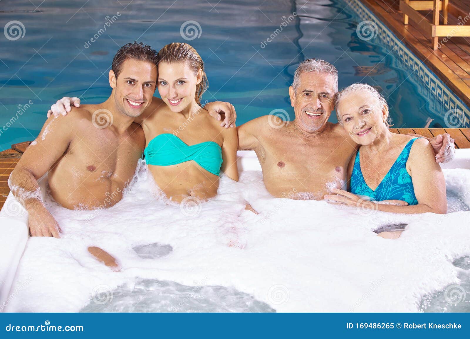 Two Couples In The Hot Tub With Foam Stock Image Image