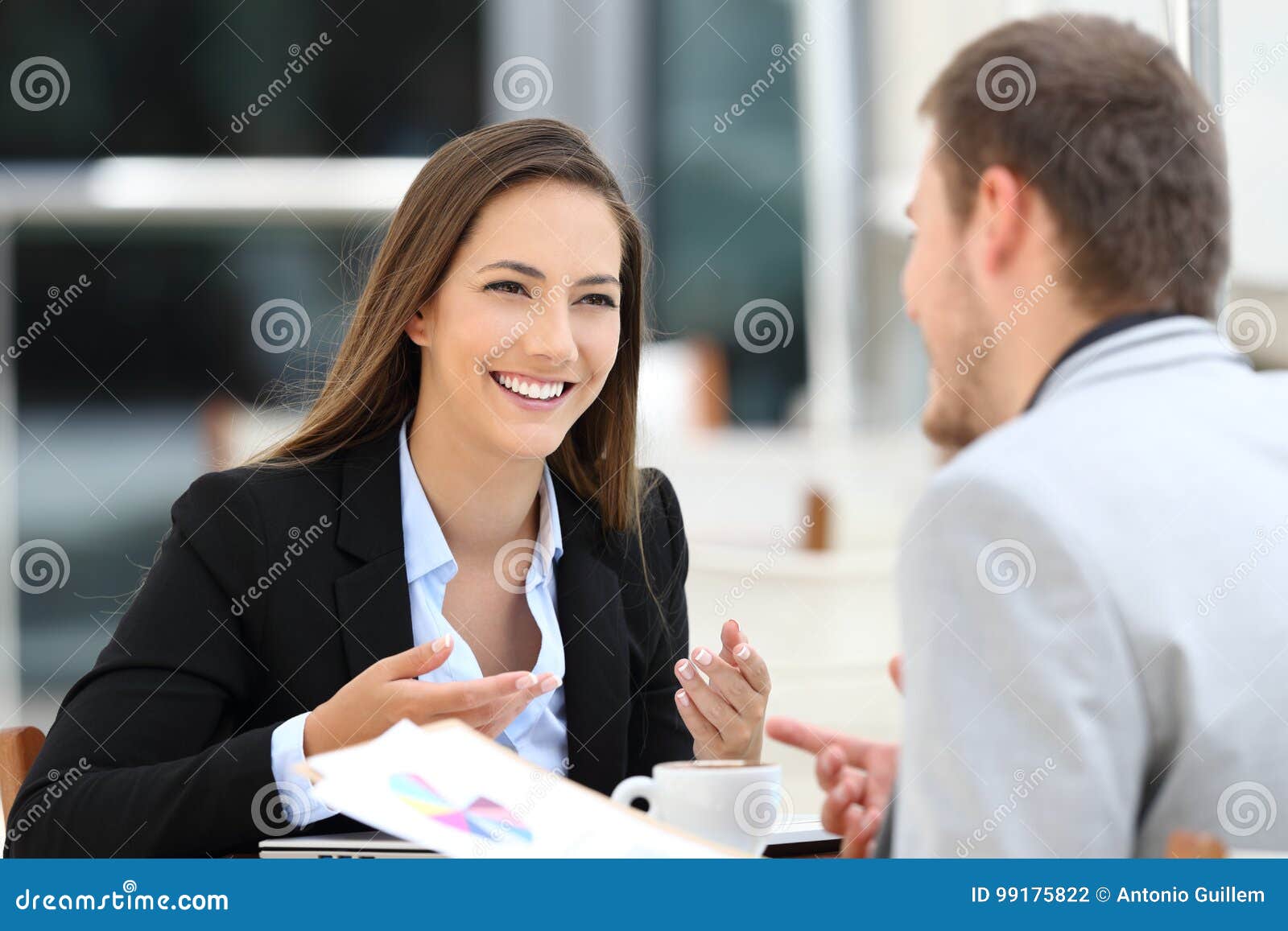 two executives having a business conversation in a bar