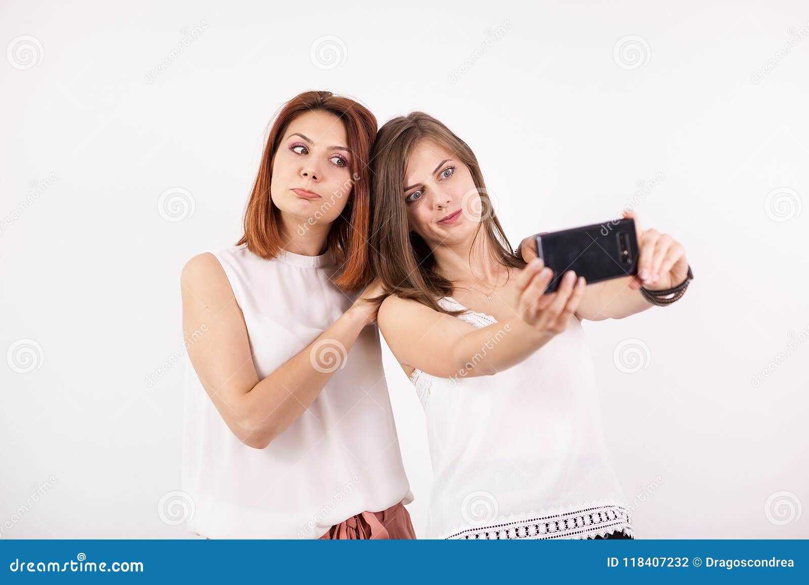 Two Happy Girls Taking a Selfie Stock Photo - Image of looking, making ...