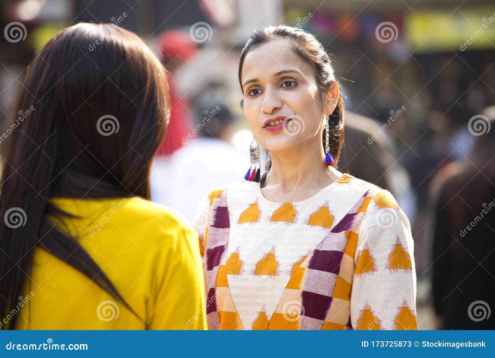 two women having fun at surajkund mela