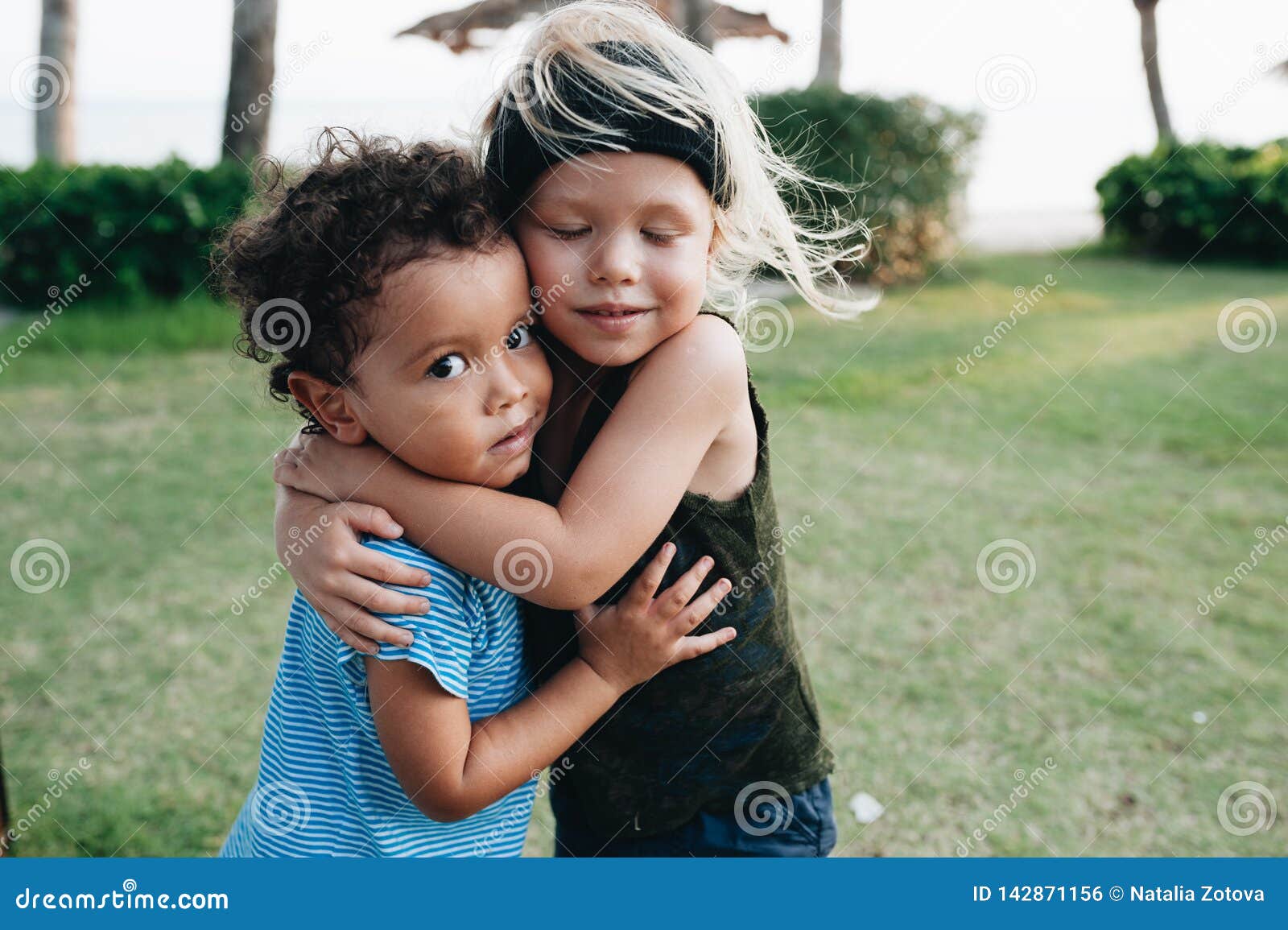Two Happy Little Boys Hug Each Other Stock Photo Image of palm