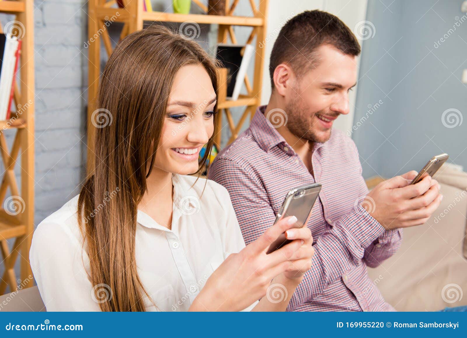 Two Happy Lovers with Mobile Phones Typing Messages Stock Photo Image of friend, female 169955220