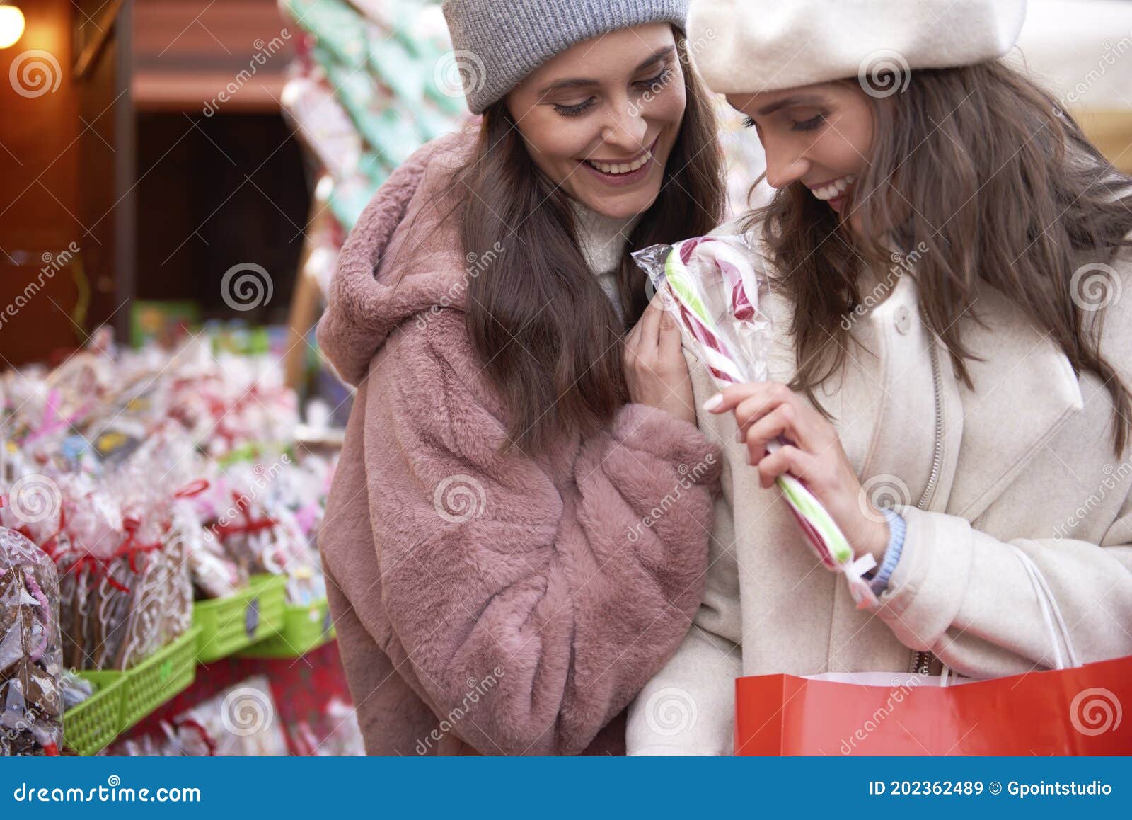 Two Women Buying Candy Cane on Christmas Market Stock Image - Image of ...