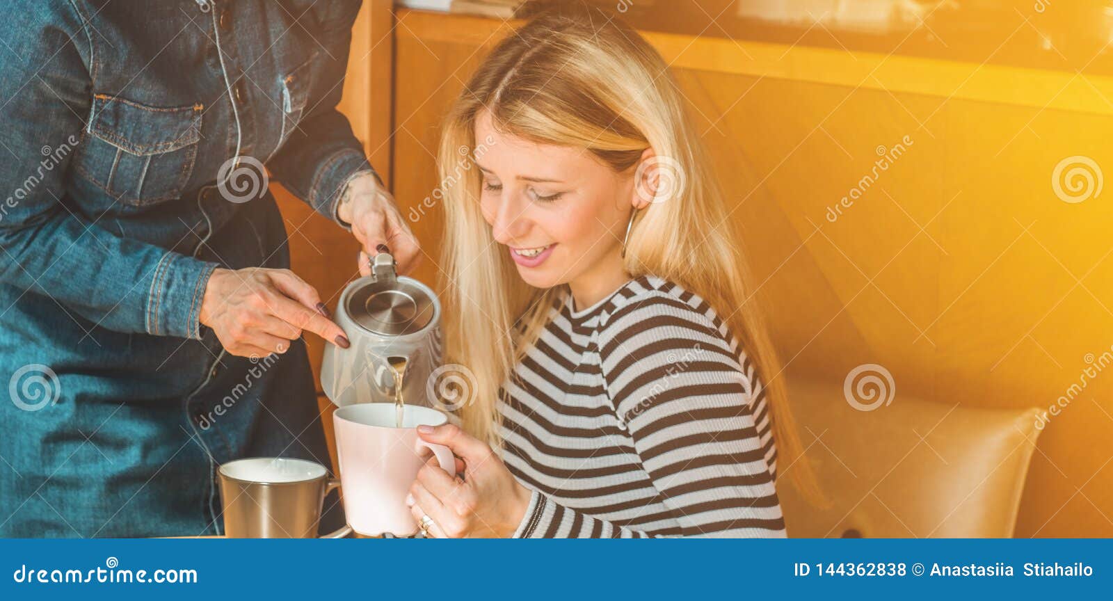 Two Happy Women Sitting in a Cafe, Drink a Hot Tea, Tell Each Other Funny  Stories, Being in a Good Mood, Laughing Happily Stock Photo - Image of funny,  real: 144362838
