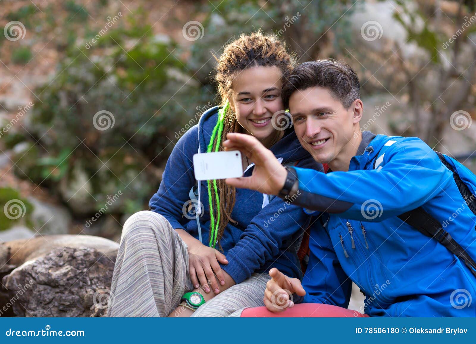 Two Hikers Man And Girl Taking Photo With Mobile Telephone Stock Photo