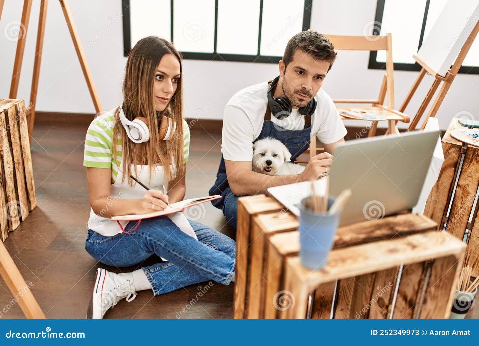Two Hispanic Students Having Online Paint Class Using Laptop Stock
