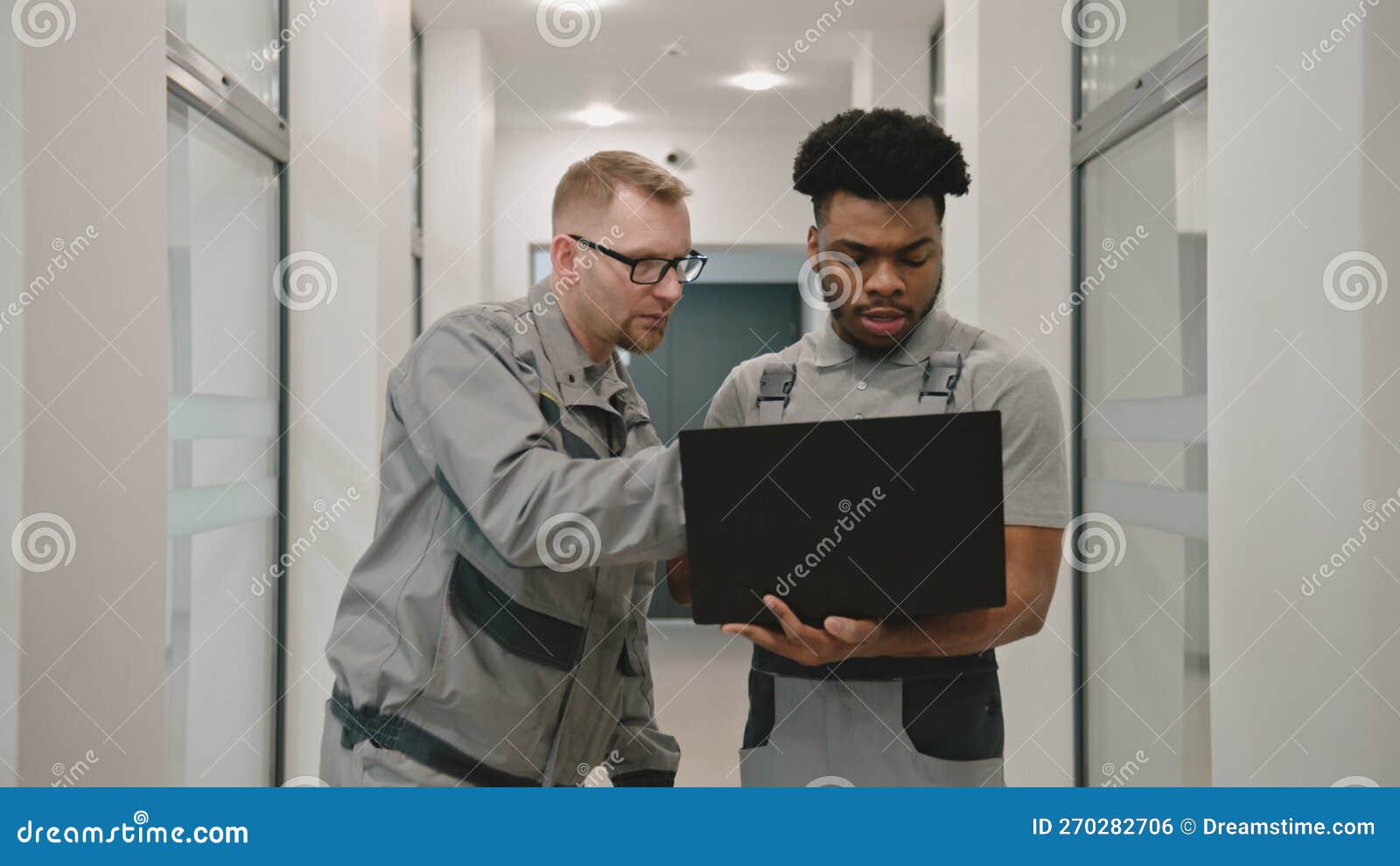 Installers Set Up CCTV Cameras on Laptop Stock Photo - Image of
