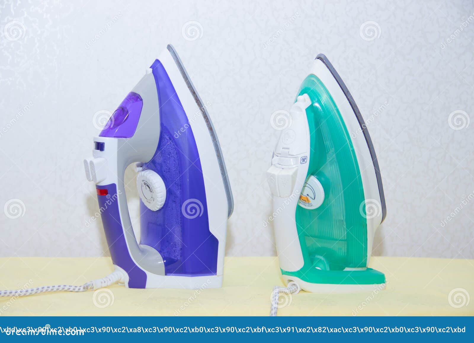 Two Irons on an Ironing Board. Selection and Comparison of Irons. Ironing Board Stock Photo