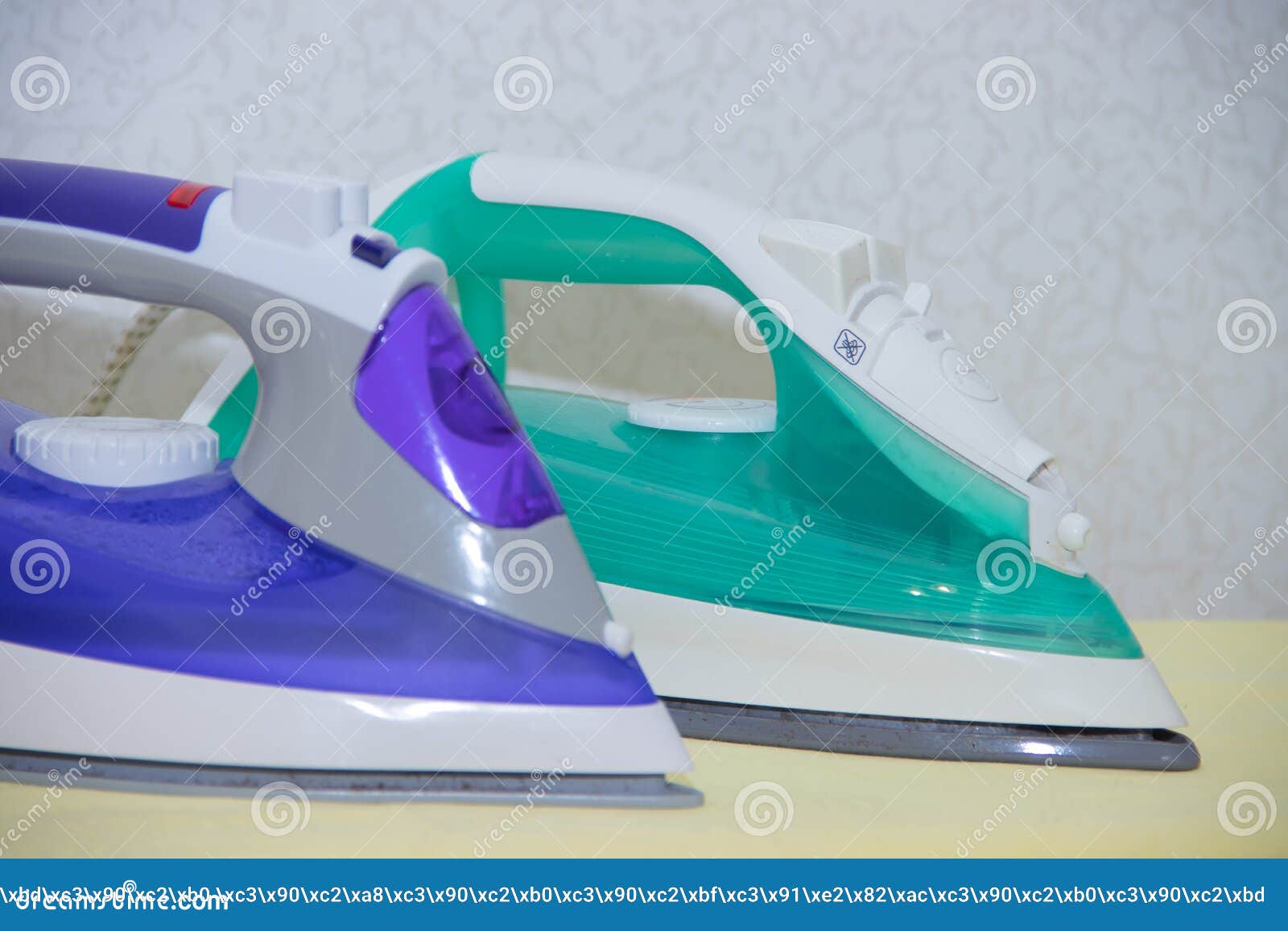 Two Irons on an Ironing Board. Selection and Comparison of Irons