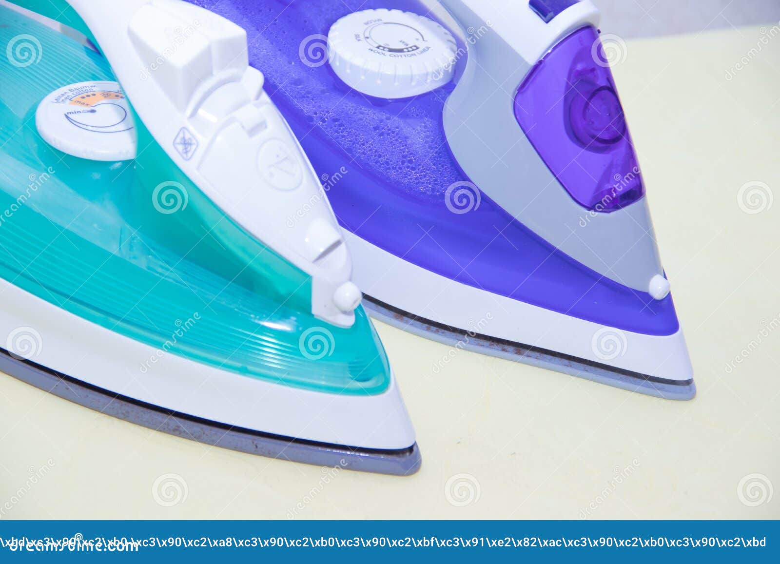 Two Irons on an Ironing Board. Selection and Comparison of Irons. Ironing Board Stock Image
