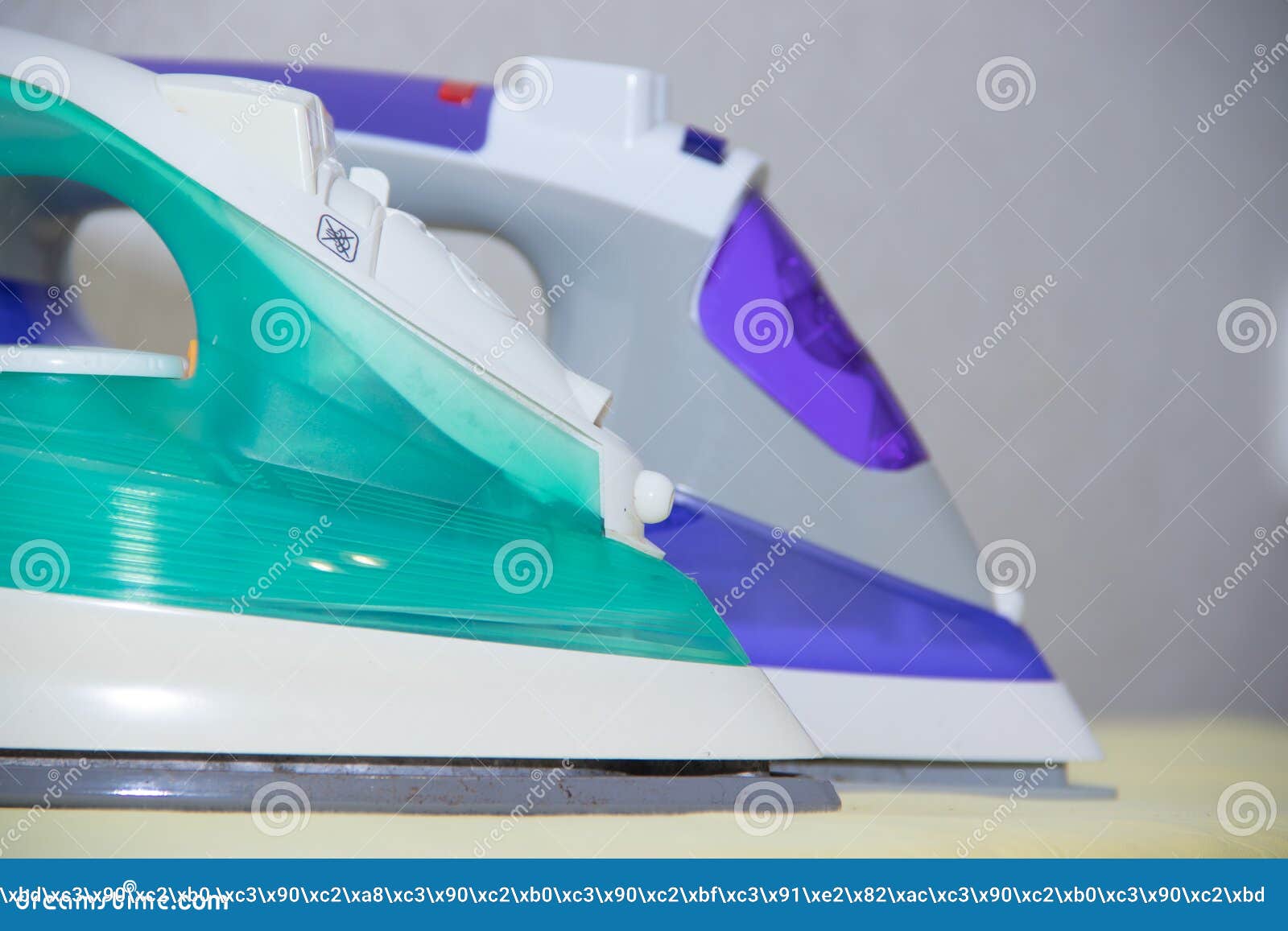 Two Irons on an Ironing Board. Selection and Comparison of Irons