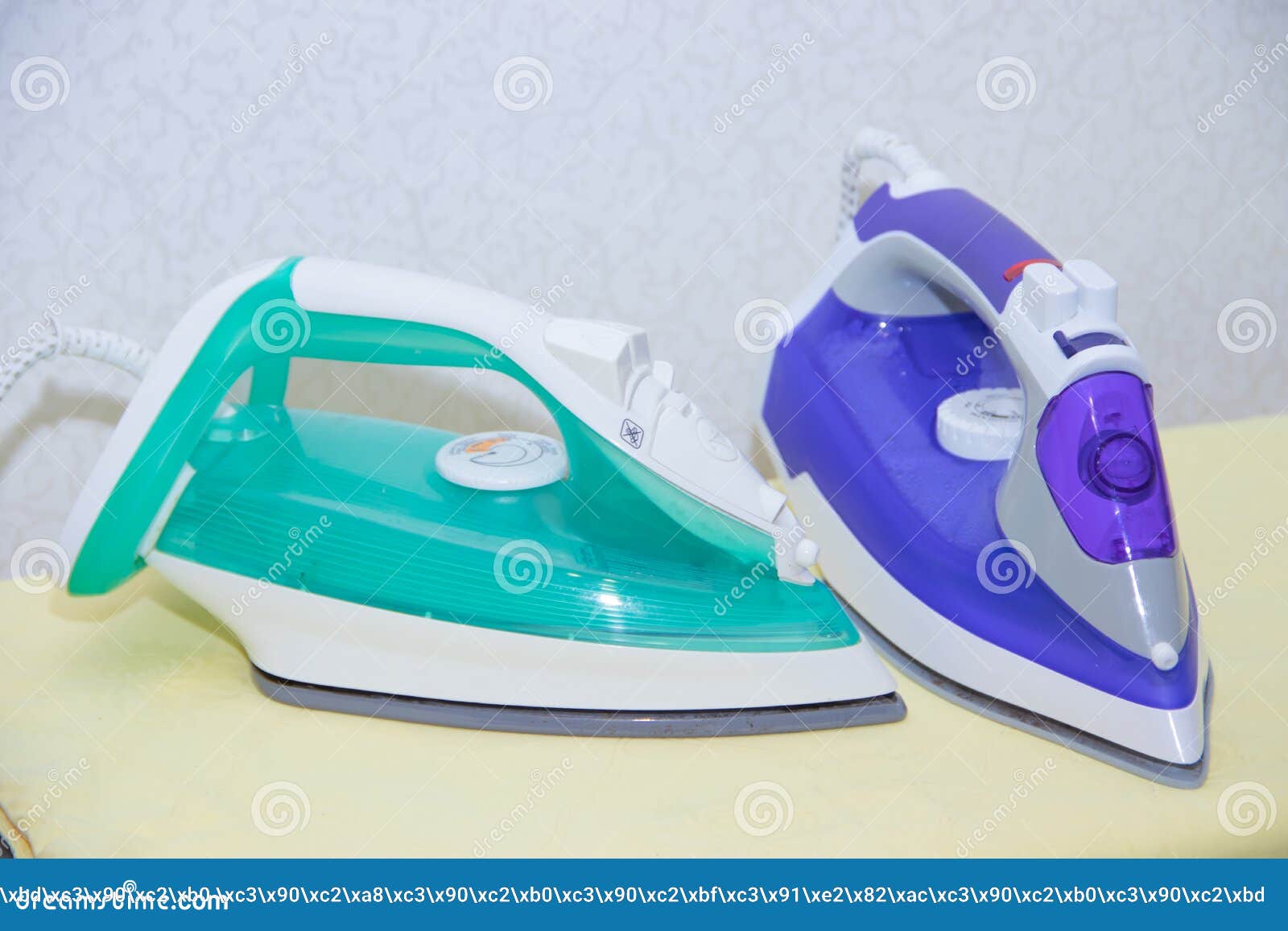 Two Irons On An Ironing Board. Selection And Comparison Of Irons. Ironing Board Stock Photo