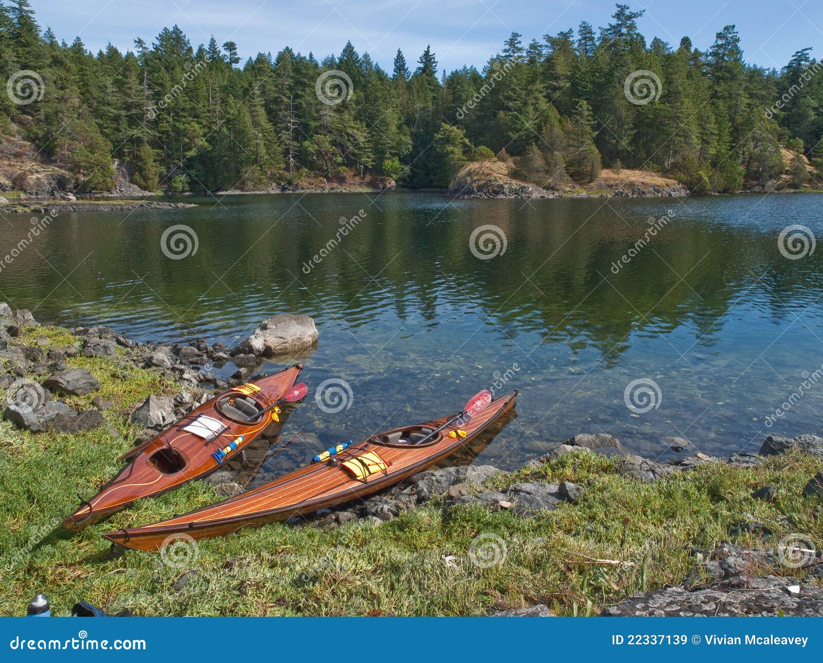 Two kayaks on rocky shore stock image. Image of smuggler 22337139