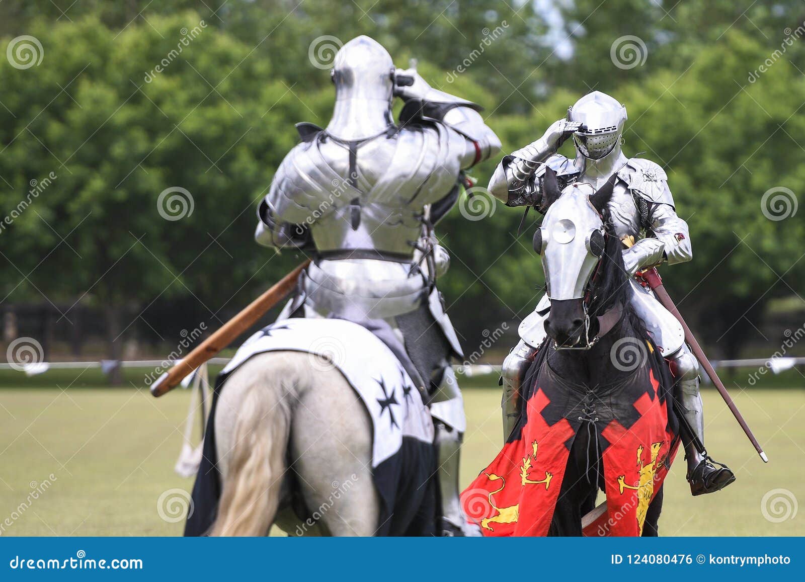 two knights salute during medieval jousting tournament