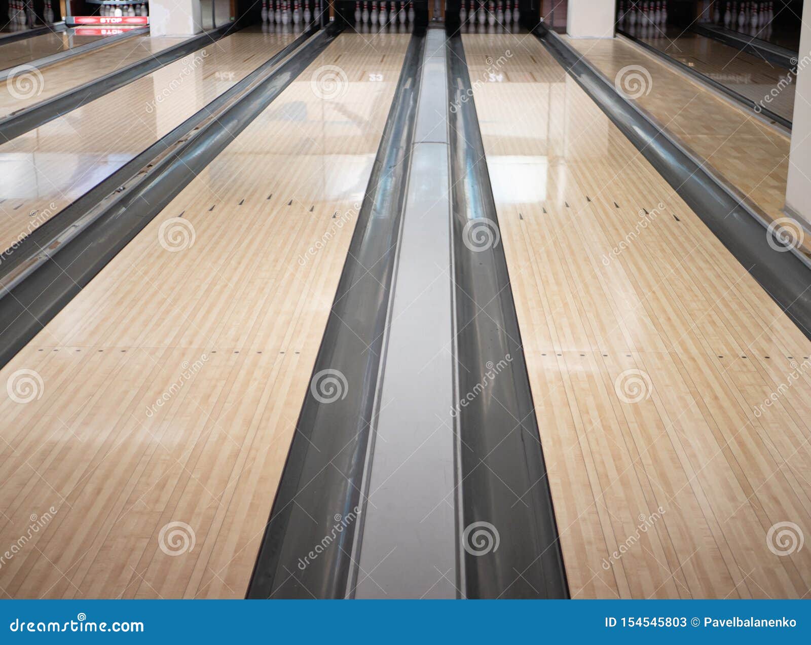 Two Lanes Tracks at Bowling Club with Bunch of Bowls Pins at Far ...