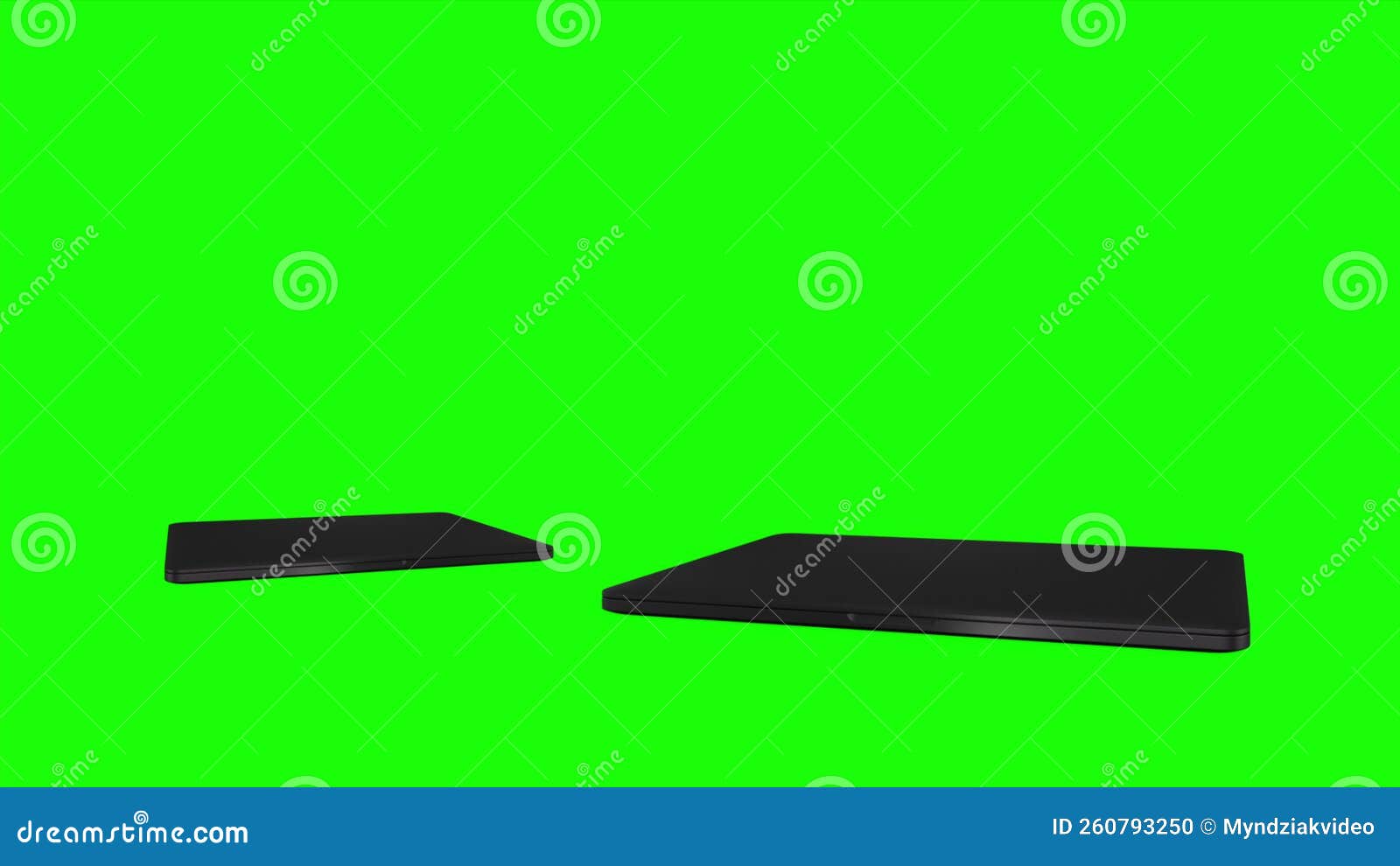 Two Laptop Revolves Around on a Black Background. Green Screen with