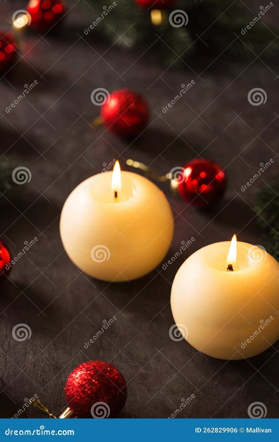 Two Large Round Candles with Christmas Decoration Stock Photo Image