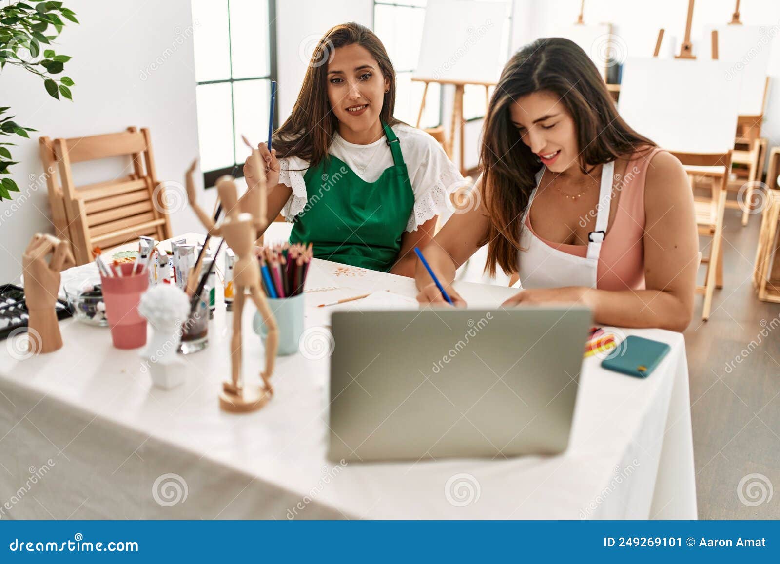Two Latin Paint Students Smiling Happy Having Online Paint Class at Art