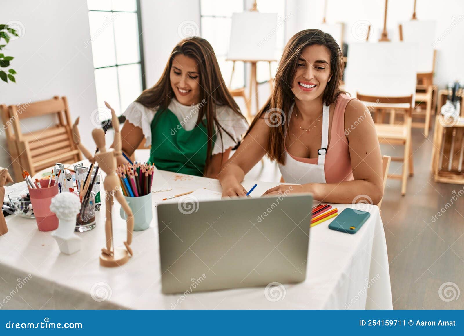 Two Latin Paint Students Smiling Happy Having Online Paint Class at Art
