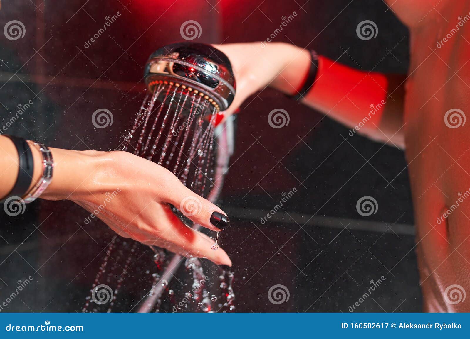 Two Lesbian Girls In The Shower Shower Head With Pouring Water And A Female Hand Stock Image