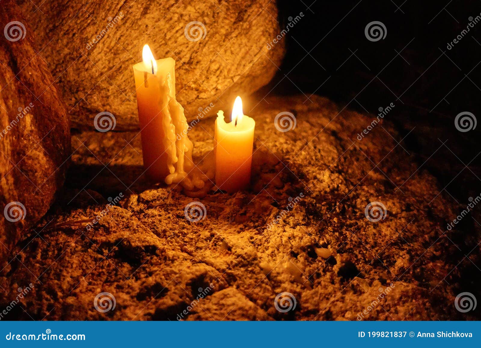 Two Lighted Candles Stand on the Rocks at Dusk at Night Stock Image Image of easter