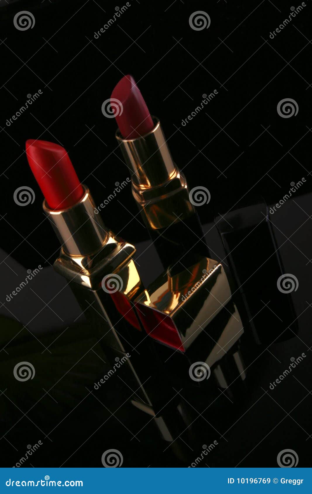 Two lipsticks on black stock image. Image of beauty, life 10196769