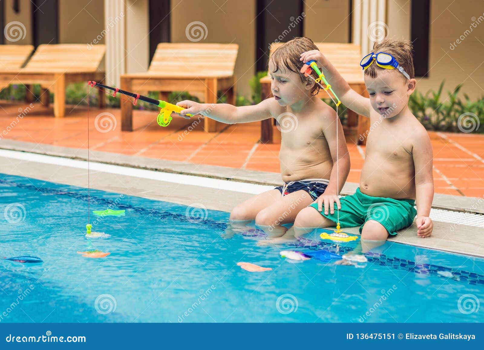 Two Little Cute Boy is Catching a Toy Fish in the Pool Stock Image - Image  of happiness, emotional: 136475151