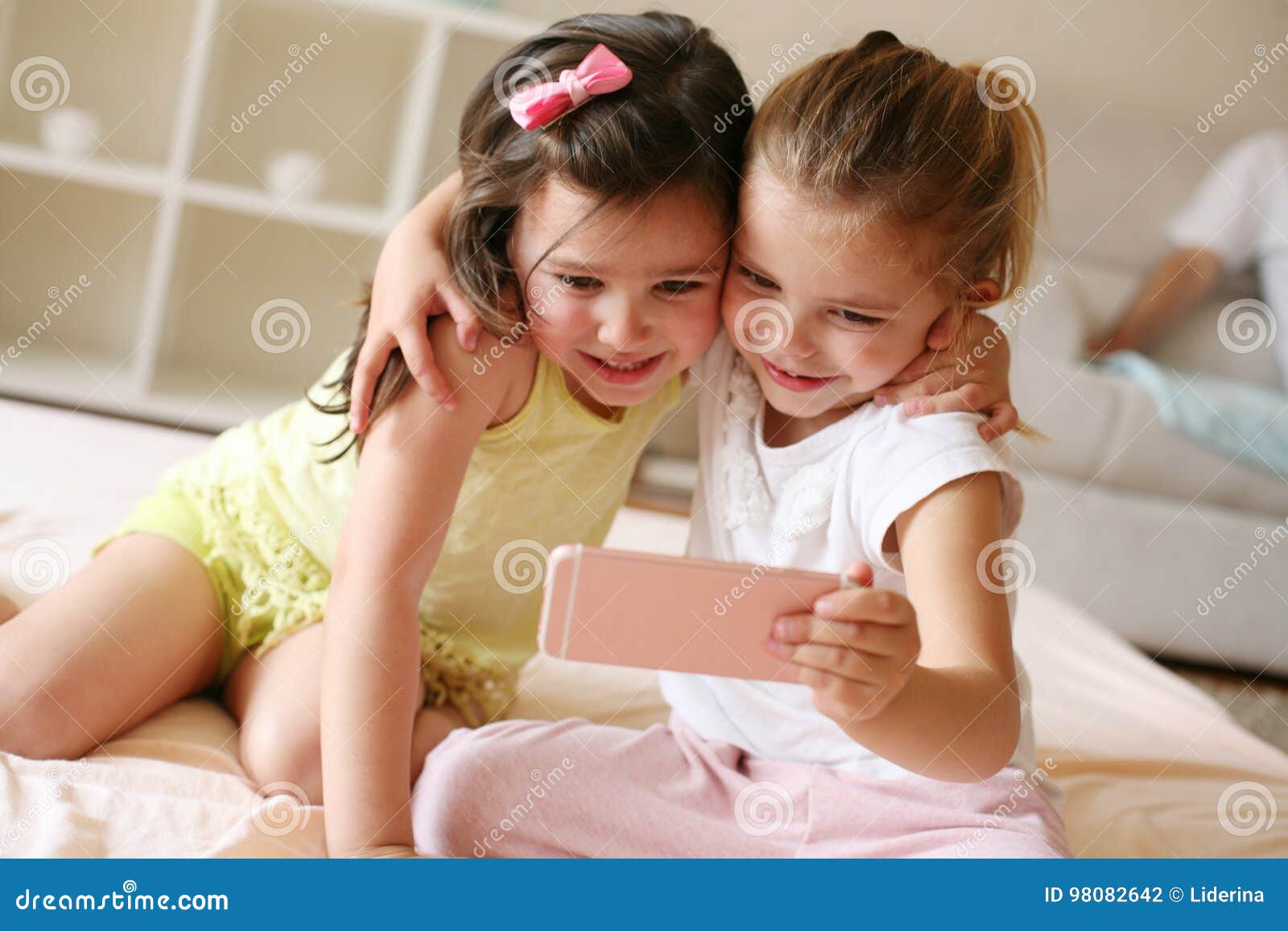 Two little girls at home. stock photo. Image of friendship - 98082642
