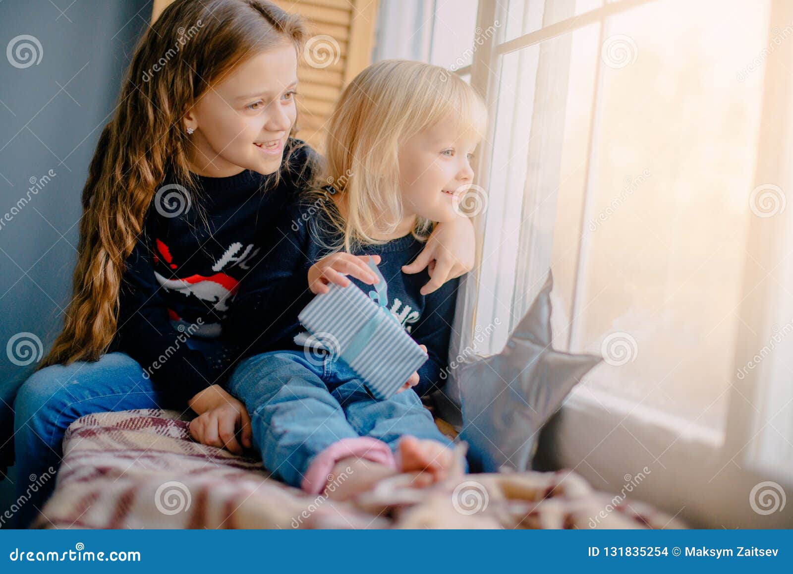 Two Little Girls Look Out Window on Christmas Eve Stock Photo - Image ...