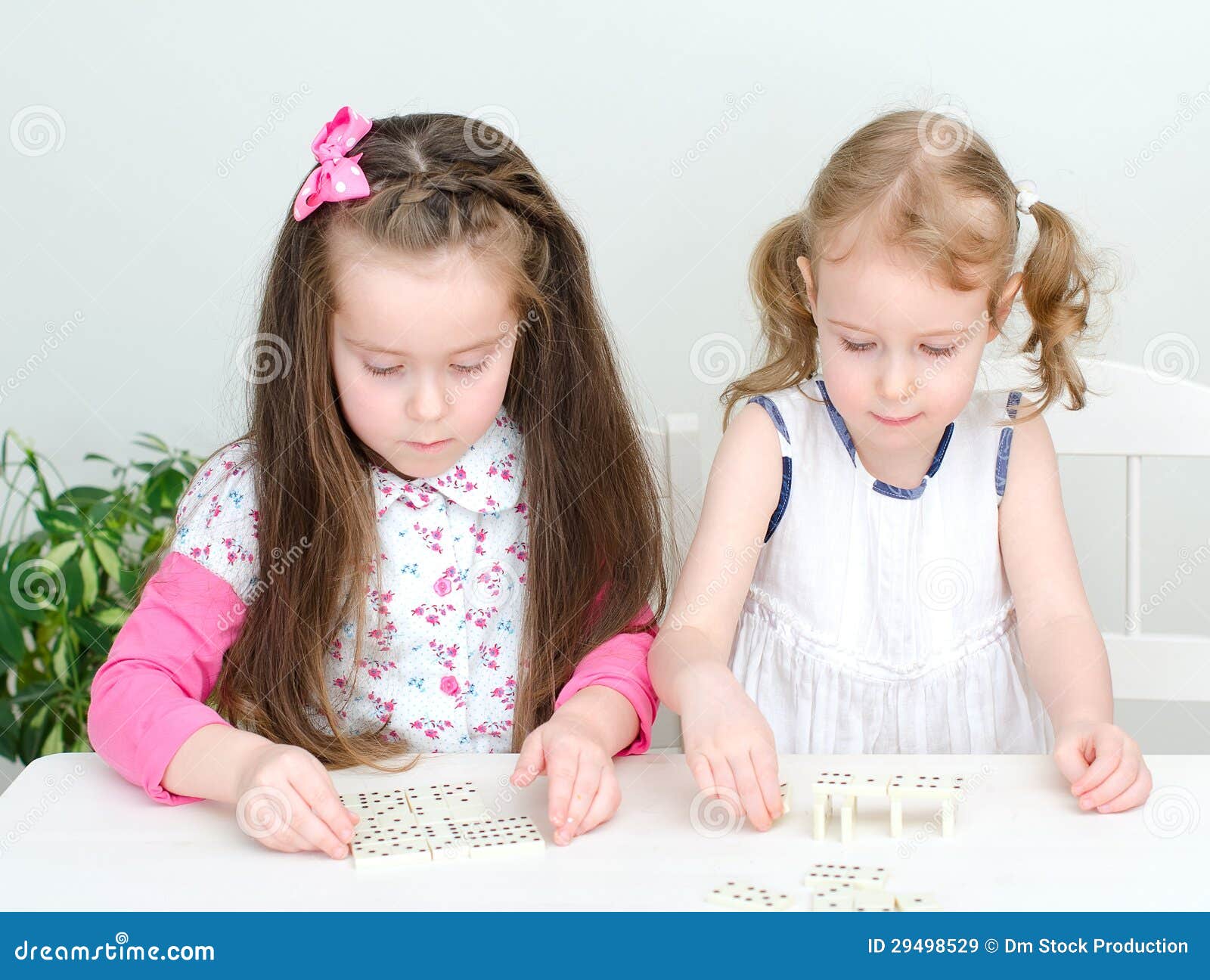 Two Little Girls Playing Domino Royalty Free Stock Images - Image 