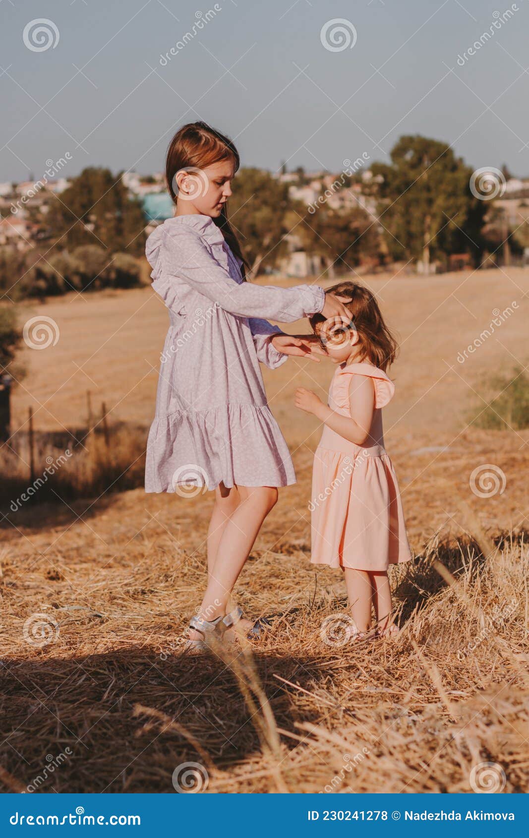 Two Little Girls Wearing Casual Dresses ...