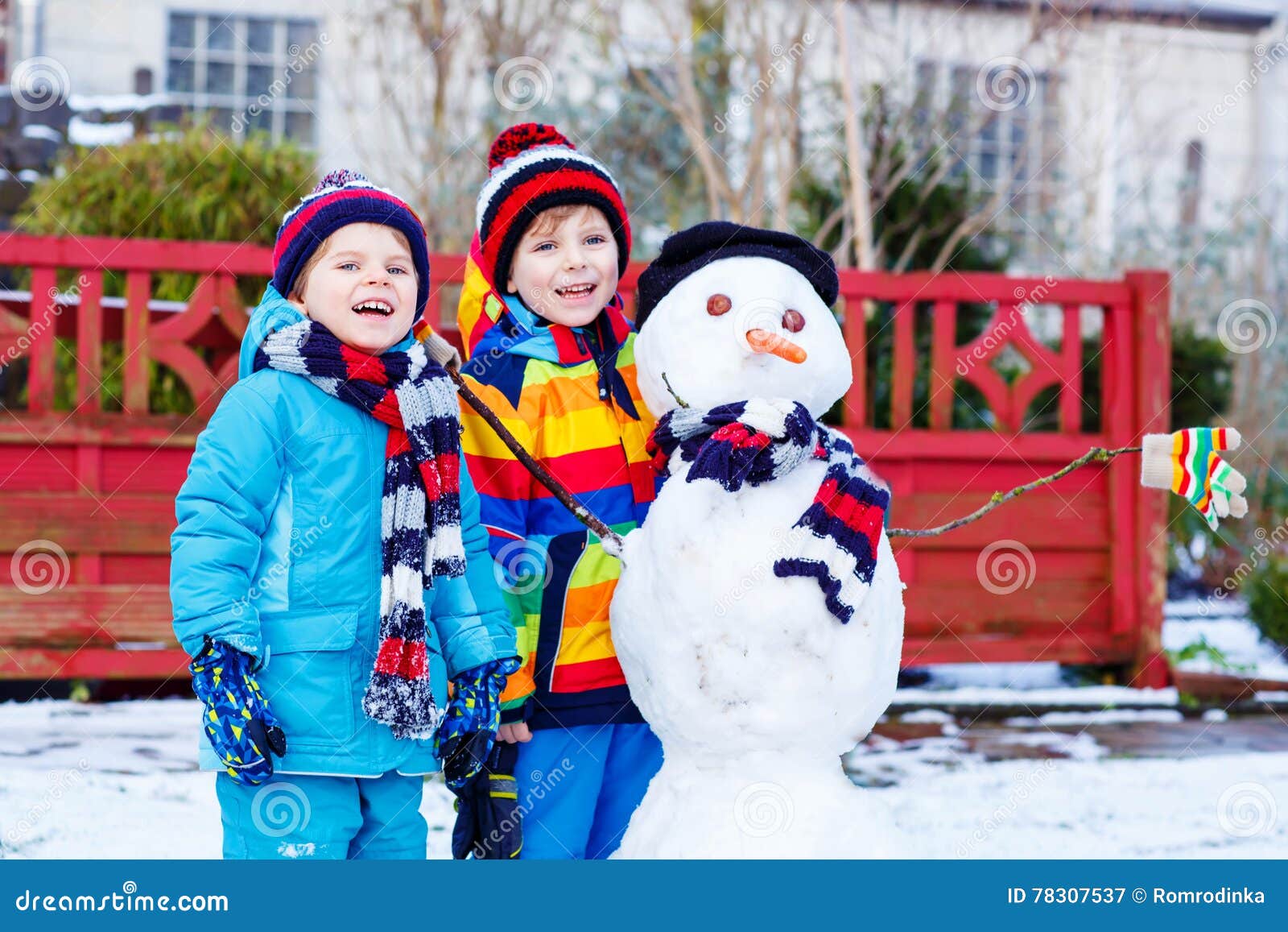 Download Two Little Siblings Boys Making A Snowman In Winter Stock Image - Image of friendship, germany ...