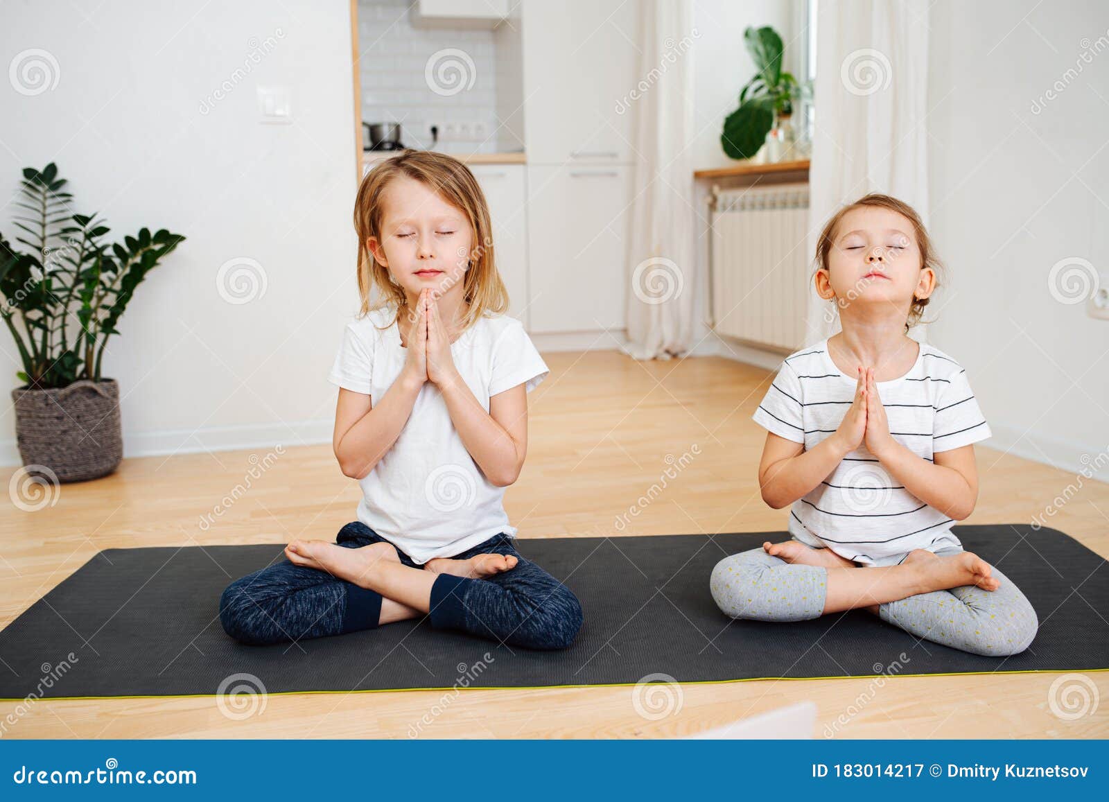 Seated in self. Athlete do lotus position. Full lotus. Cross legged sitting  pose. Asana in yoga Stock Photo - Alamy