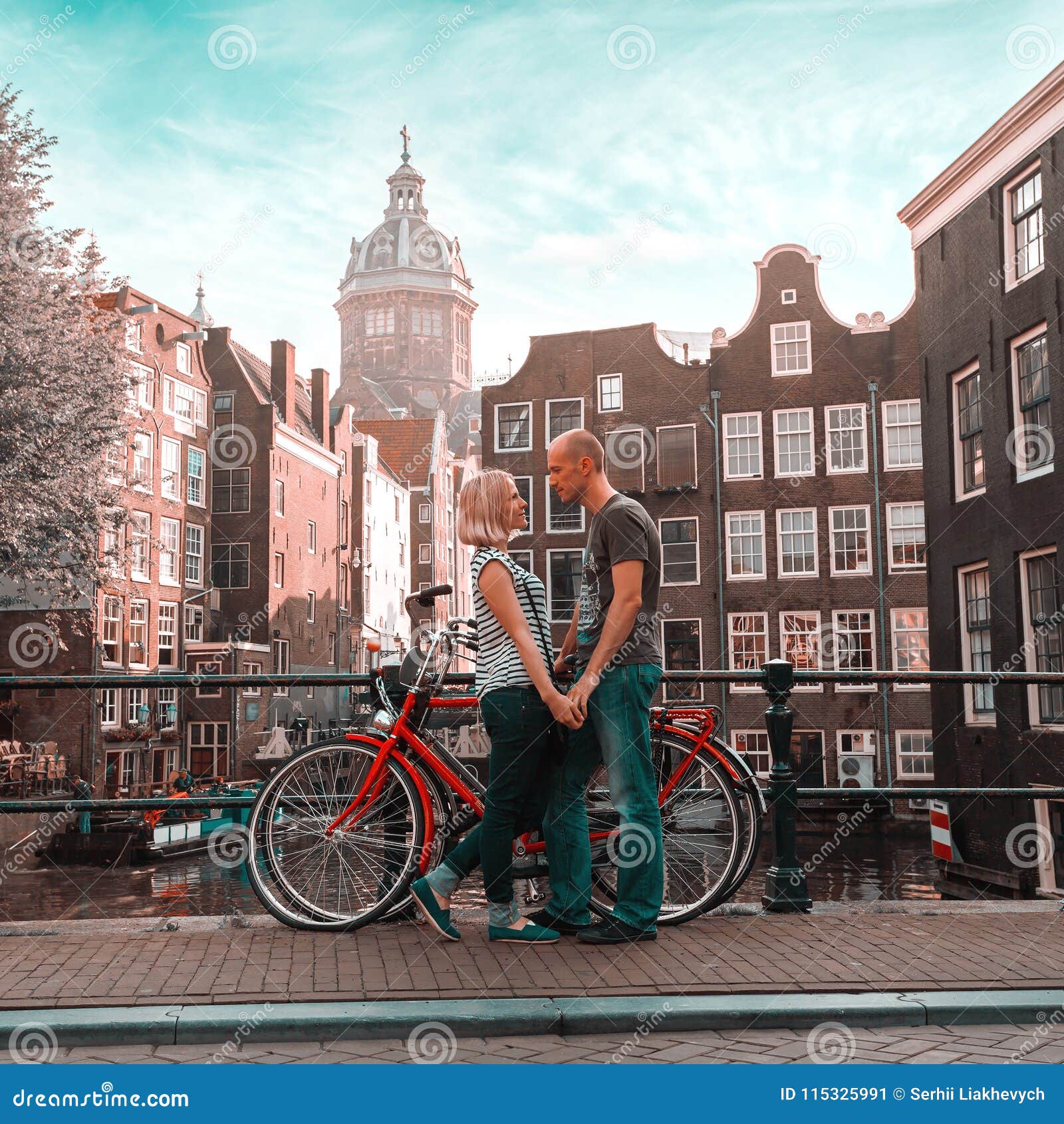 Verbeteren schijf Middellandse Zee Two Lovers Person in Amsterdam on a Background of Multi-colored House in  the Dutch Style Stand and Hold Hands. Stock Image - Image of landmark,  beautiful: 115325991